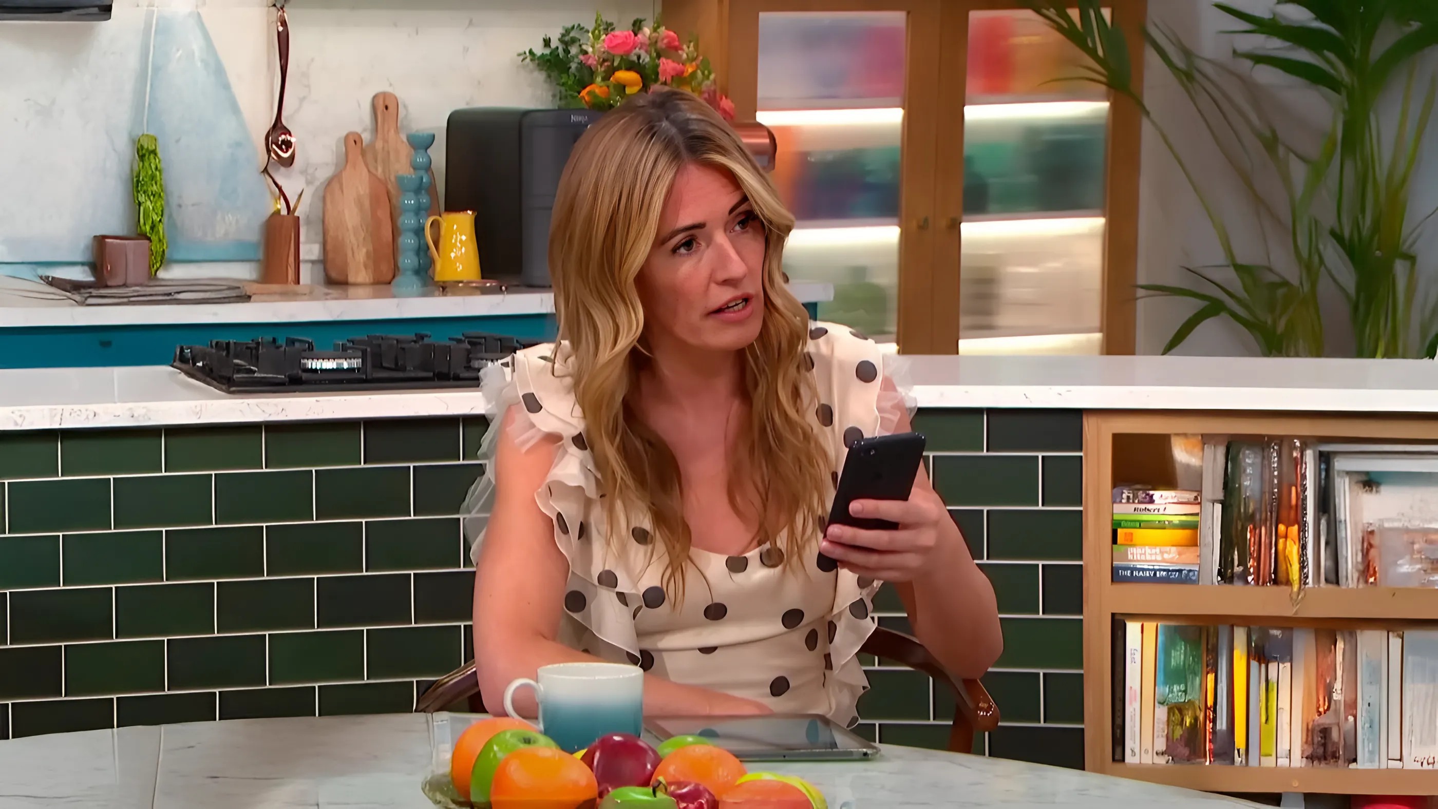 Cat Deeley reluctantly handed her iPhone to Martin Lewis, allowing him to register an account right then and there.